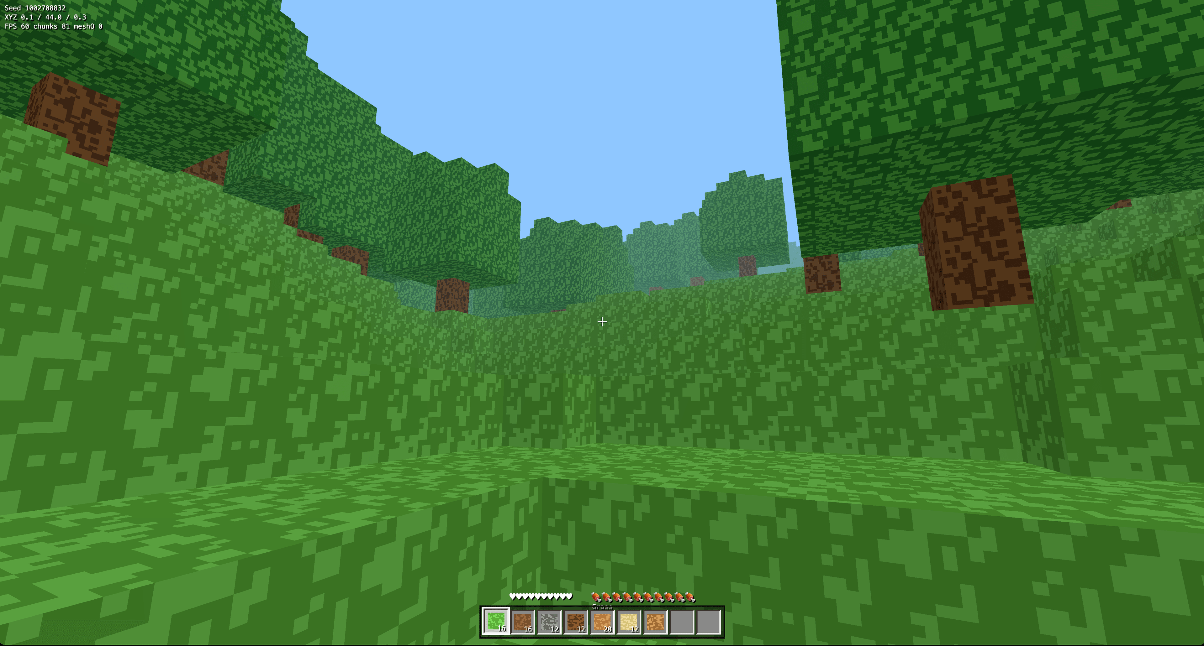 Minecraft-style voxel game showing a grassy block landscape and inventory bar